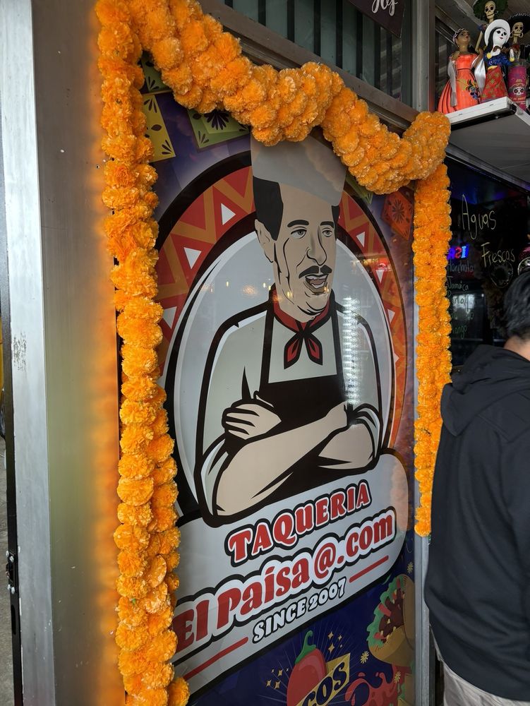 The Taqueria El Paisa sign and entrance